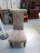 A 19th century Prie Dieu chair with tapestry seat and back