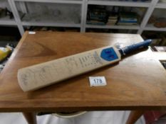 A miniature Retford Cricket Club signed cricket bat