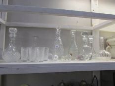 A shelf of decanters and glasses