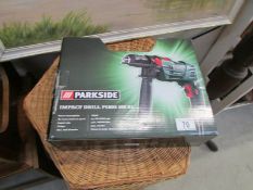 A boxed electric impact drill (used)