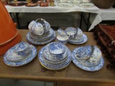 Approximately 34 pieces of 19th century blue and white tea ware