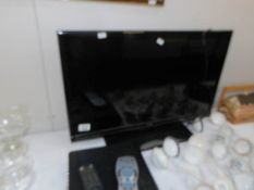 A 28" flat screen television with Sky plus HD box