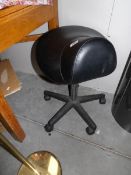 A revolving office stool