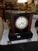 A 19th century black marble mantel clock