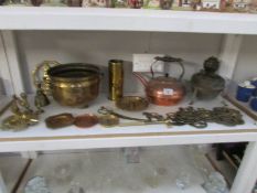 A shelf of brass and copper