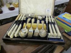 An oak cased canteen of cutlery