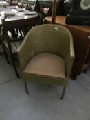 A gold coloured bedroom chair