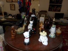 A quantity of novelty decanters and scent bottles