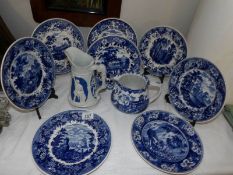 A quantity of blue and white plates and jugs