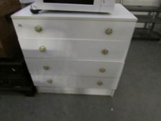 A white 4 drawer chest