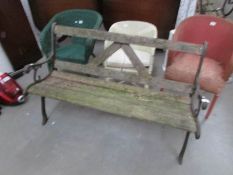 A metal and wood garden bench