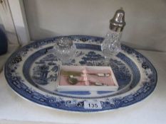 A blue and white meat platter, a child's cutlery set,