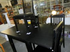 A black ash fold over table & 4 chairs