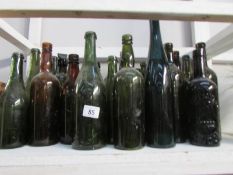 A quantity of dark glass bottles