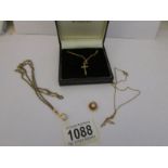 A 9ct gold cross on chain, a 9ct gold pearl pendant,