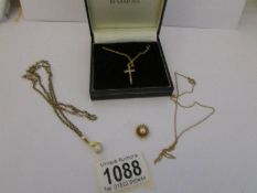 A 9ct gold cross on chain, a 9ct gold pearl pendant,