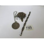 A silver coin pendant and 2 other items