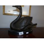 A bronze figure of a swan