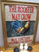 A large gilt framed 'Rooster may crow' tin pub style sign