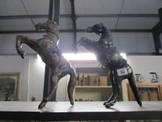 2 rearing horse figures