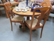 A mahogany table and 3 chairs
