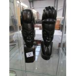 A pair of carved hard wood African native heads