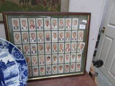 A framed and glazed set of Player's cricketer cigarette cards