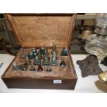 A vintage Alchemist's box with apothecary bottles