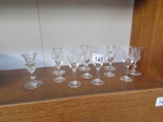 A quantity of small liquer glasses