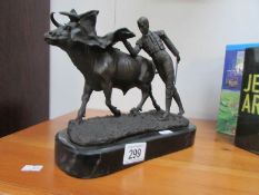 A bronze toreodor with bull