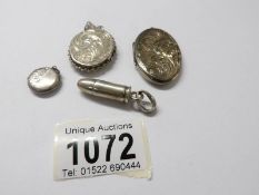 3 silver lockets and an un marked bullet pendant