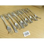 11 silver dessert forks, hall marked Sheffield 1908, maker H A,