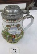 A German beer stein with pewter lid