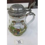 A German beer stein with pewter lid