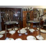 A set of 6 oak wheel back chairs