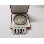 A 1974 USA silver proof IKE dollar