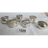 6 silver napkin rings,