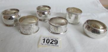 6 silver napkin rings,