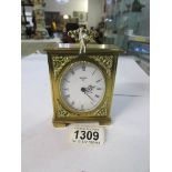 A brass mantel clock marked Swiza