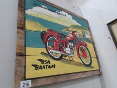A painted sign of a BSA bantam on pine boards