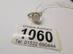 A 9ct gold ring set opal,