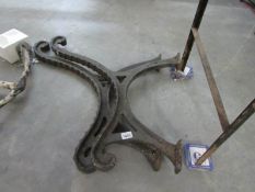 A pair of old cast iron bench ends