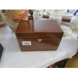 A Victorian mahogany tea caddy