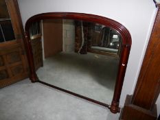 A large overmantel mirror