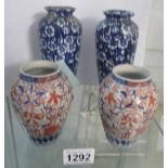 A pair of early Chinese vases, 14cm tall and a pair of antique blue and white vases,