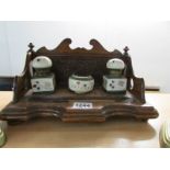 An oak inkstand with ink pots and nib brush a/f