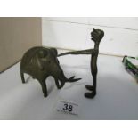 An African stylised bronze elephant and a bronze water diviner