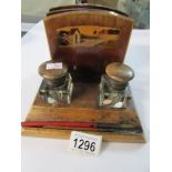 A vintage ink stand complete with inkwells and dip pens