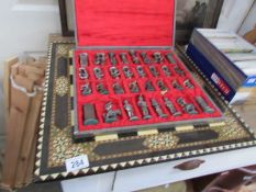 A cased chess set and board