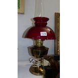 A converted Aladdin oil lamp with chimney and shade